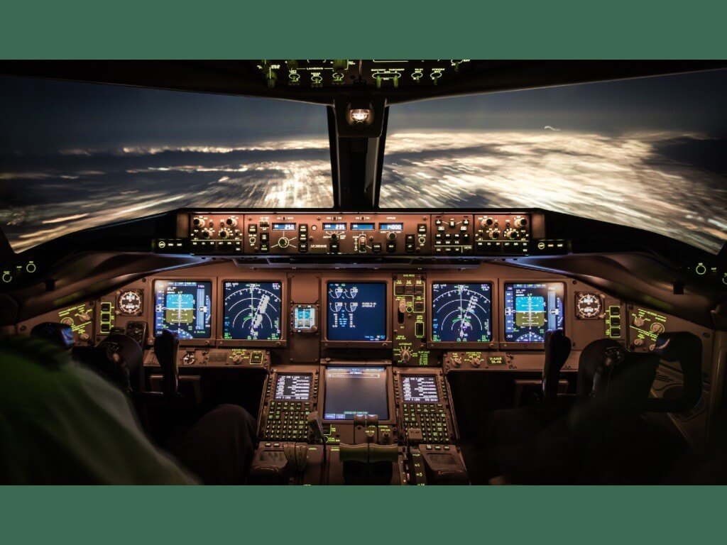 The cockpit of an airliner at night. In addition to aircraft instruments, guidance from air traffic controllers is critical for safe flying./Contributed photo