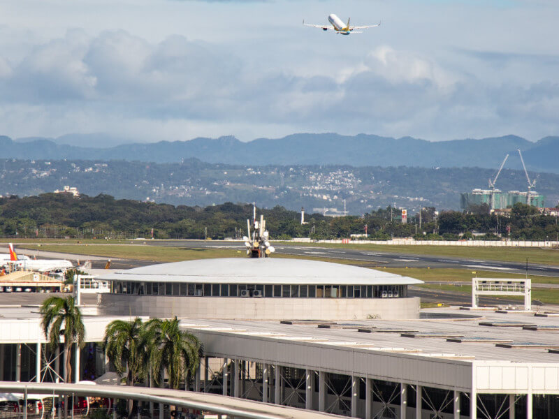 A plane takes off from Ninoy Aquino International Airport, which is set for major upgrades as SMC takes over operations on Sept. 14 this year. 