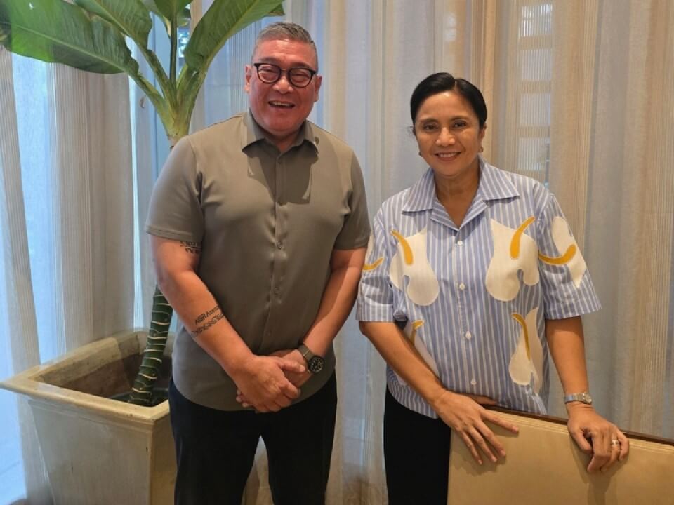 The author with former Vice President Leni Robredo