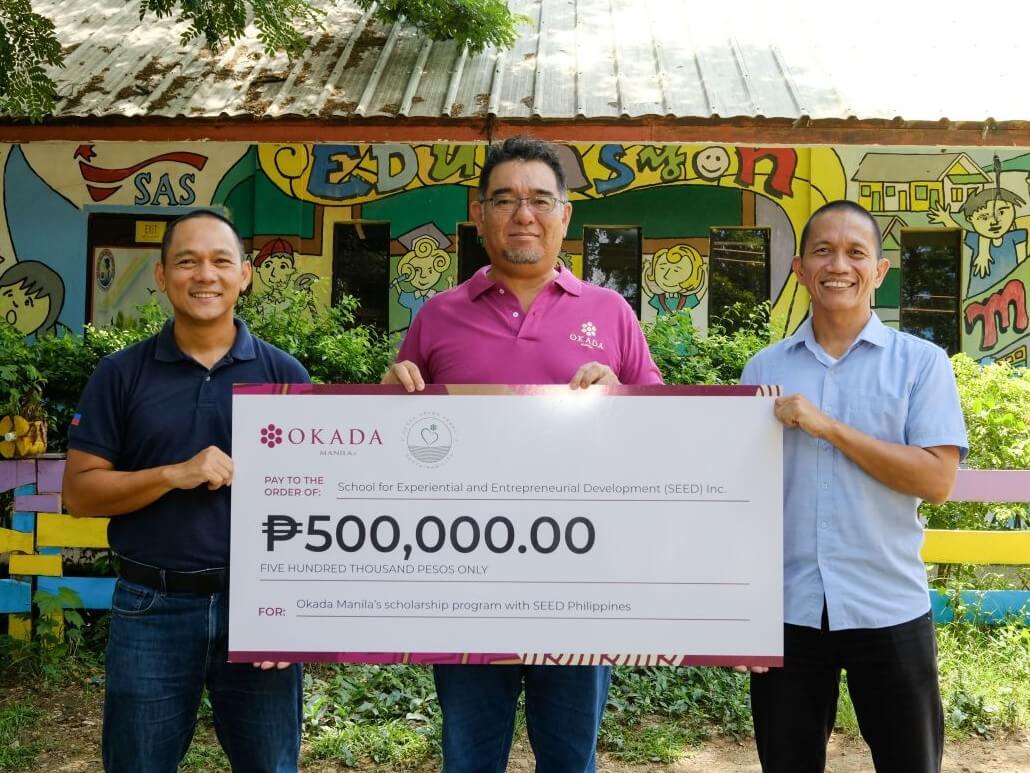 SEED Philippines Director Mark Lawrence Cruz and Gawad Kalinga executive director Daniel Bercasio receive the donation from Kenji Sugiyama (center), managing director and CSR committee member of Okada Manila./ Photo from Okada Manila