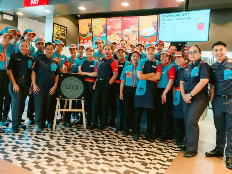 Jollibee crew members stand at the forefront of the brand&rsquo;s sustainability push at its Enrile, Tuguegarao branch, the Philippines&rsquo; first LEED-certified quick service restaurant, where energy-efficient systems and eco-friendly practices are part of daily operations. &nbsp;| Contributed photo