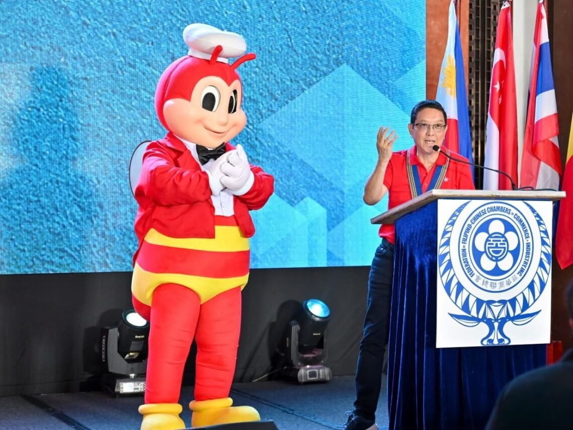 Jollibee Group global president and CEO Ernesto Tanmantiong, accompanied onstage by the iconic Jollibee mascot, speaks at the 2026 ASEAN Chinese Business Leaders Summit in Pasay City on Oct. 19, highlighting the global potential of ASEAN&rsquo;s homegrown brands. | Contributed photo
