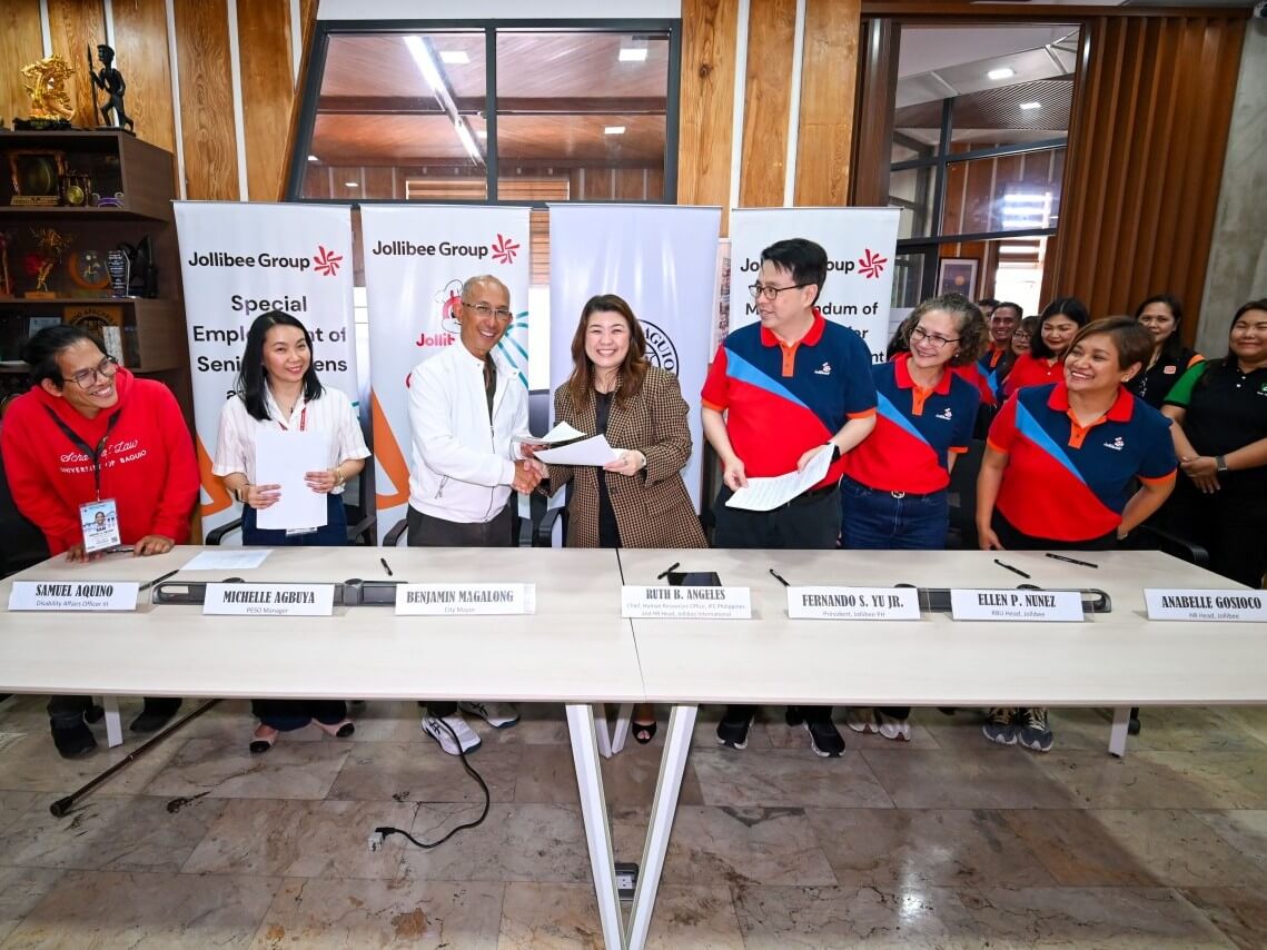 Opening doors to inclusive work: The Jollibee Group expands employment for senior citizens and persons with disabilities through local government partnerships. Baguio City Mayor Benjamin Magalong (3rd from left) and Ruth B. Angeles, chief human resources officer of Jollibee Group Philippines and head of Human Resources for Jollibee Brand International (4th from left), formalize the agreement enabling qualified seniors and PWDs to work across participating Jollibee, Chowking, Greenwich, and Burger King stores in the city. | Contributed photo