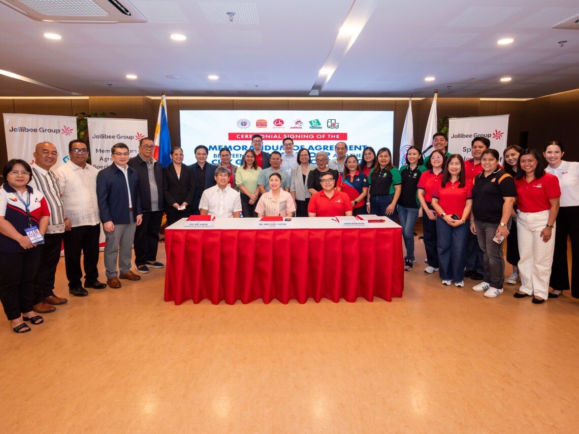 Taguig City Mayor Maria Laarni Cayetano (center, seated) joins Gerald Juliano (right, seated), HR director, Jollibee Group PH, and Atty. Raul Academia (left, seated), public affairs head, Jollibee Group, together with representatives from the Taguig City government and the Jollibee Group following the signing of a Memorandum of Agreement to expand inclusive employment opportunities for qualified senior citizens and persons with disabilities in participating company-owned stores in Taguig. | Contributed photo