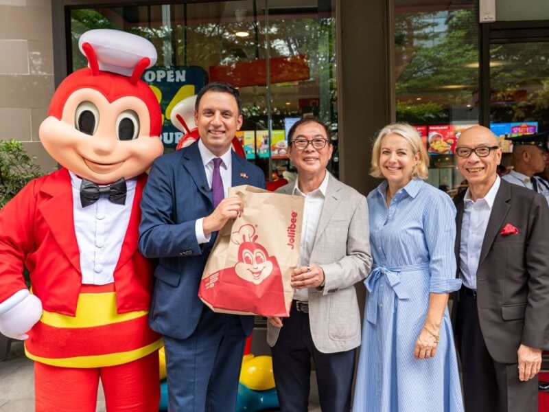 UK Minister for Trade Anas Sarwar (left) and UK Ambassador to the Philippines Sarah Hulton, OBE (second from right), are welcomed by Jollibee Group chairman and founder Tony Tan Caktiong (second from left) and global chief business support officer William Tan Untiong at Jollibee's BGC Triangle Drive store on Sept. 23. | Contributed photo
