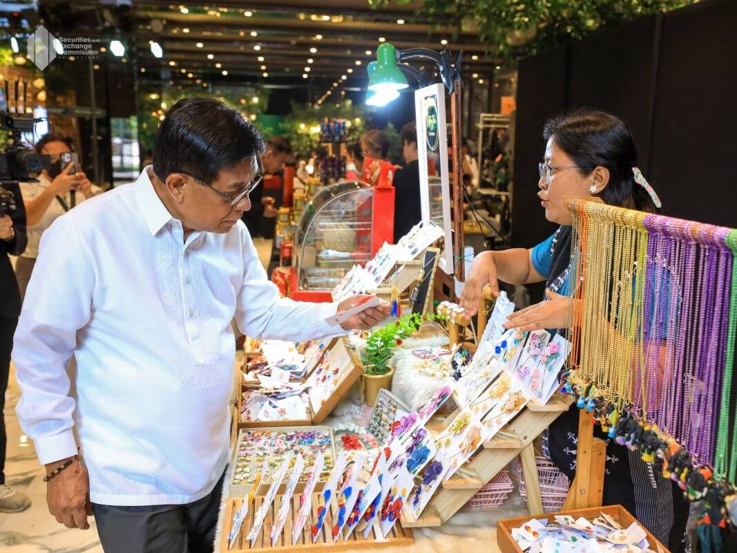SEC Chair Francis Ed. Lim views MSME products on display during the event./ Photo from the SEC