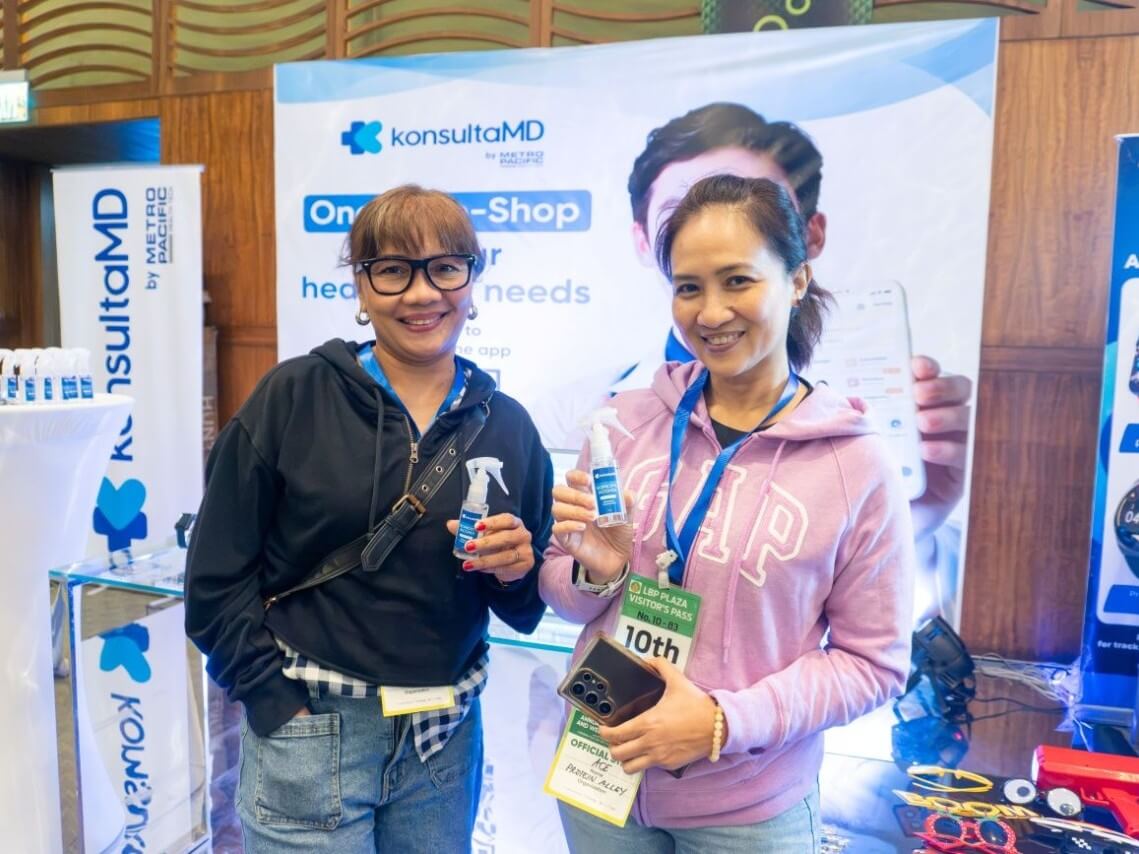Attendees visit the KonsultaMD booth at LANDBANK's AME Program launch to learn how theapp helps employees manage medical examinations and access doctor consultations. | Contributed photo