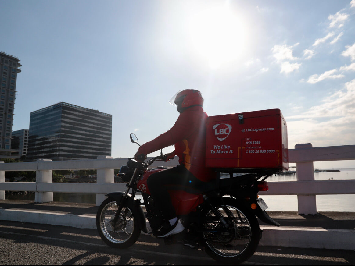 An LBC motorcycle courier on a delivery run in this file photo./Contributed Photo