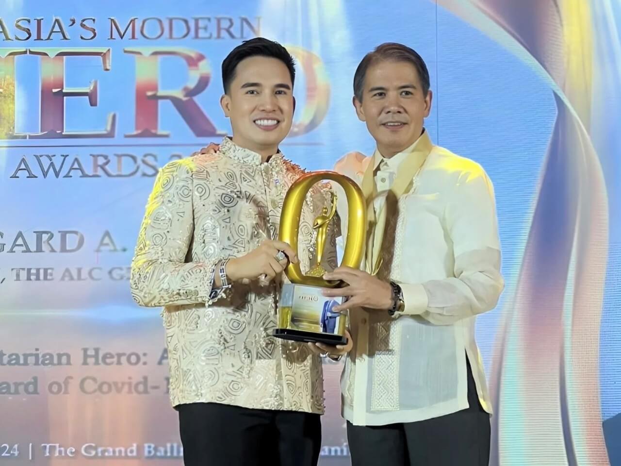 Caption: Edgard receives the Asia's Humanitarian Hero Award from Dr. Rommel Yba&ntilde;ez for his efforts during the COVID-19 pandemic. | Photo from Philippines Graphic