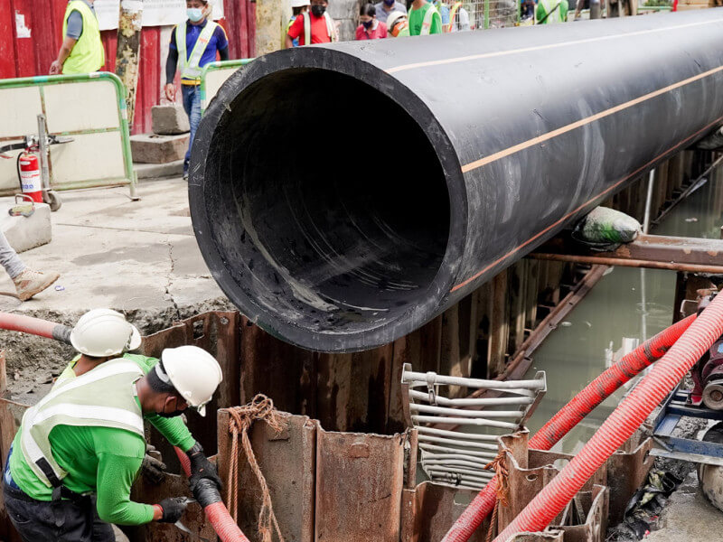 Maynilad men installing a sewer pipe./Contributed photo