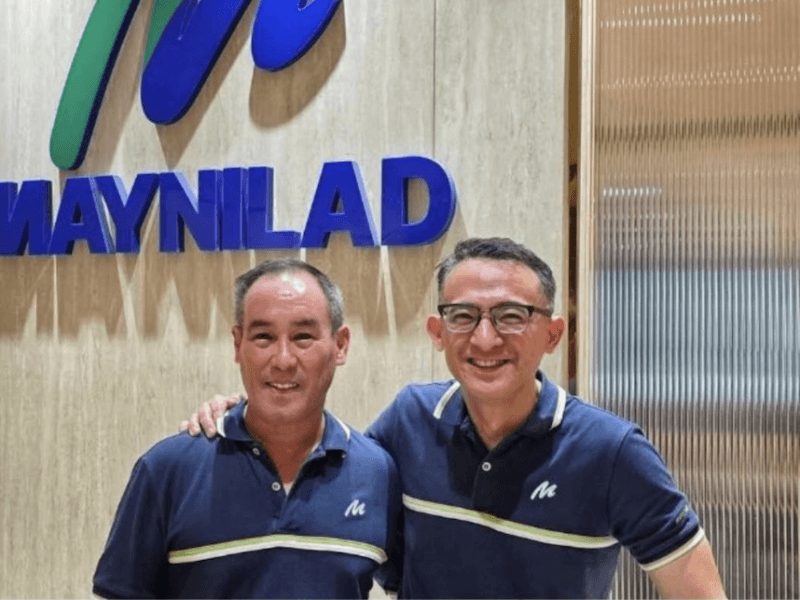 Outgoing chief operating officer Randy Estrellado (right) congratulates incoming COO Chris Lichauco, who will assume the post on Sept. 1, 2025./Photo is a screenshot taken from the Facebook page of Randy Estrellado 