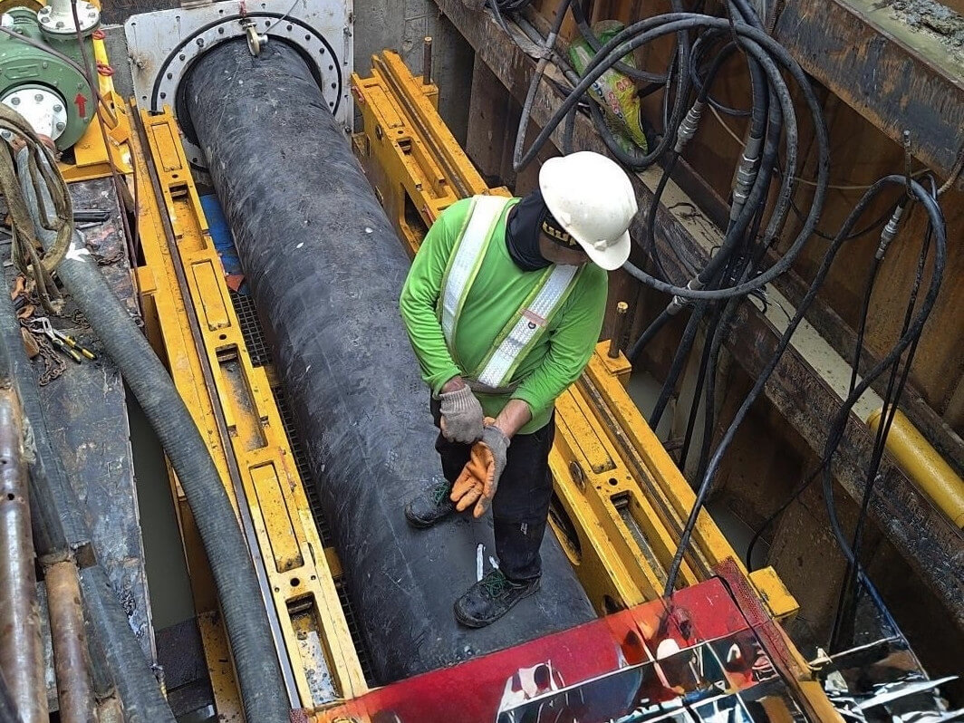 ​A Maynilad worker inspects a newly installed water main as part of the firm's P4.7-billion pipelaying program in 2024./Contributed Photo