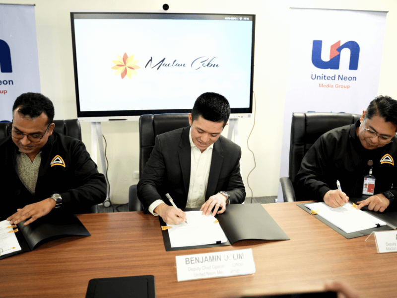 (From left) MCIA deputy chief commercial officer Nabil Rasheed, UNMG deputy chief operations officer Benjamin Ernest O. Lim, and MCIA deputy chief operations officer Aldwin Uy sign the contract between MCIA and UNMG./Contributed photo
