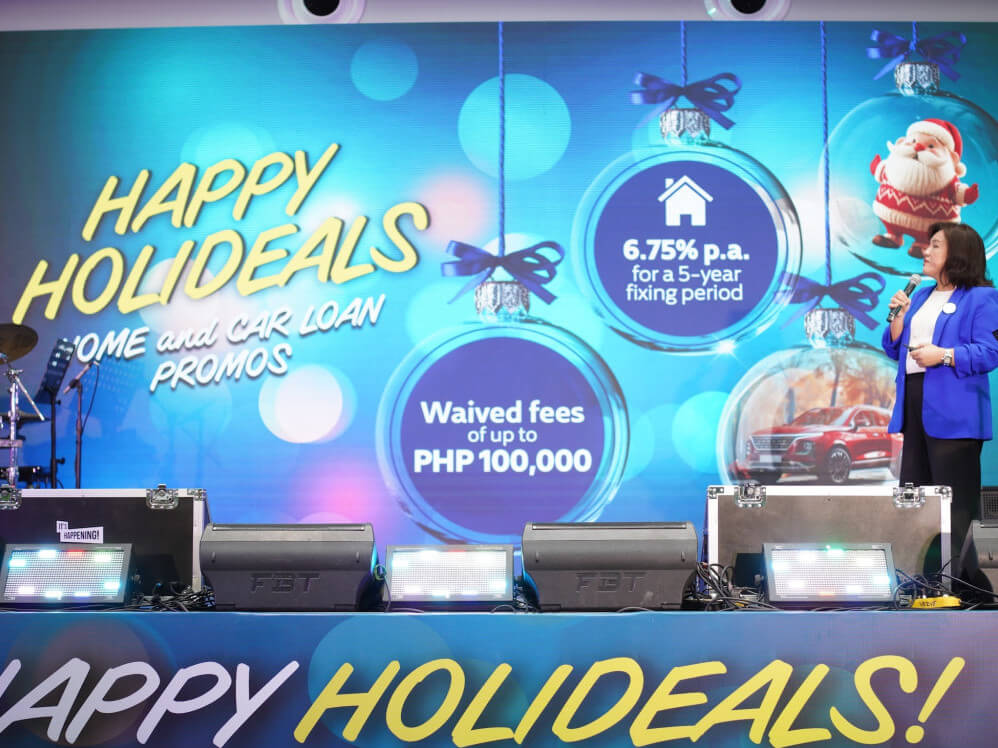 Metrobank&rsquo;s consumer lending group head Peaches Cuenco unveils the Happy Holideals promo &ndash; the bank&rsquo;s early holiday gift to aspiring home and car owners./ Contributed photo &nbsp;