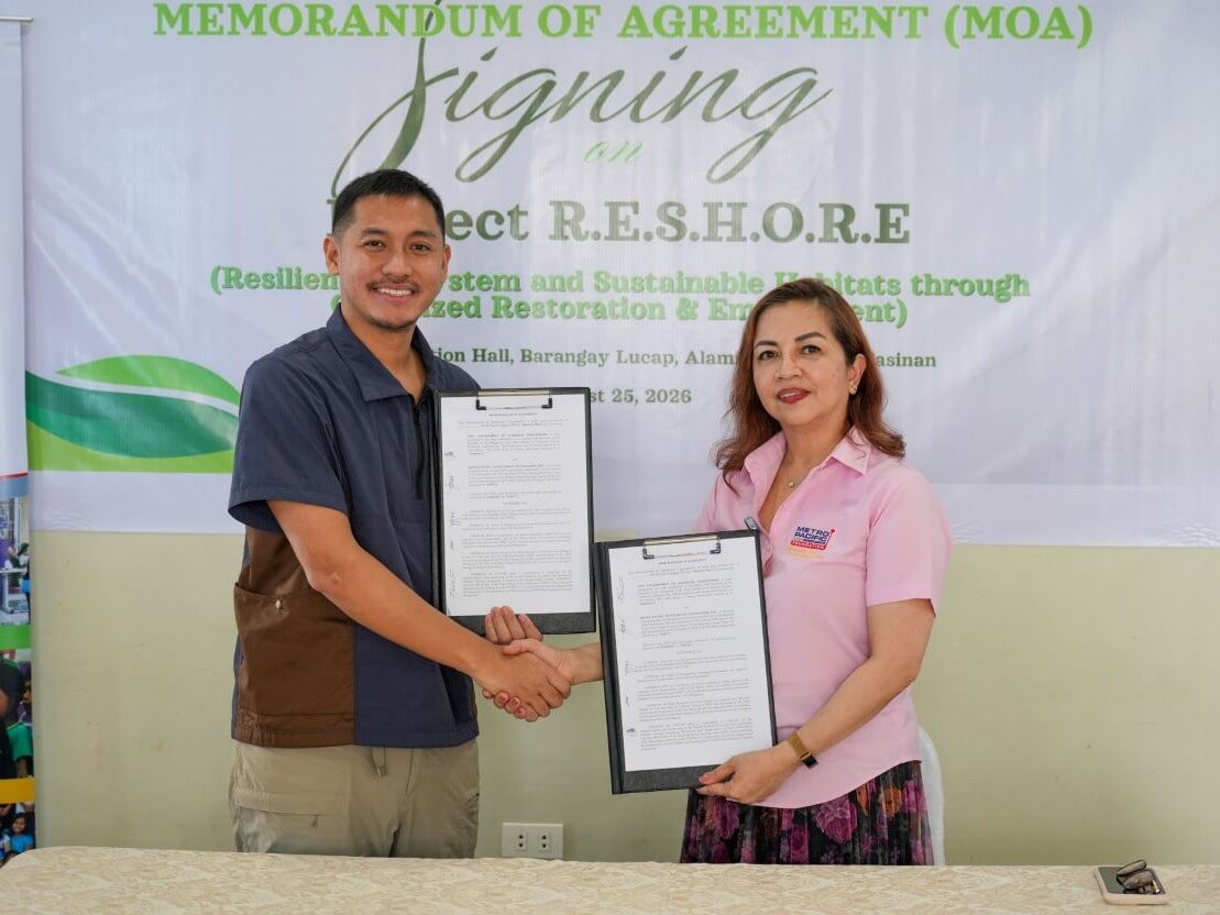 Alaminos City Mayor Arth Bryan Celeste (left) and Metro Pacific Investments Foundation President Melody del Rosario sign a memorandum of agreement for Project RESHORE in Alaminos City, Pangasinan. | Contributed photo