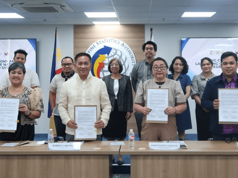 PSA Officer-in-Charge, Deputy National Statistician Minerva Eloisa P. Esquivias (front row; 2nd from right) and Assistant Secretary Rosalinda P. Bautista, Deputy National Statistician of the PhilSys Registry Office (back row; 3rd from left) joins SBCorp officials, led by president and CEO Robert C. Bastillo (front row; 2nd from left), during the ceremonial signing event for the integration of National ID authentication services to the SBMoney app. / Photo from the PSA website. (Click the photo to view the full image)