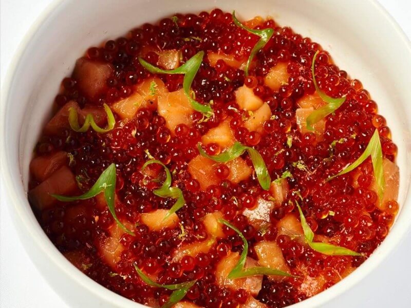 Another crowd favorite: Aurora’s house-cured, smoked, and torched salmon, layered with ikura, mentaiko, yuzu kosho, shiitake, and corn over multigrain rice/