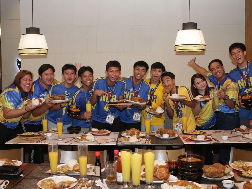Plates full and hearts fuller. NCR Palarong Pambansa volleyball athletes and their coaches enjoy a comforting meal at Max’s Laoag. A simple yet meaningful gesture that honors not just their achievements, but the spirit of community Max’s has cherished for 80 years./ Contributed photo
