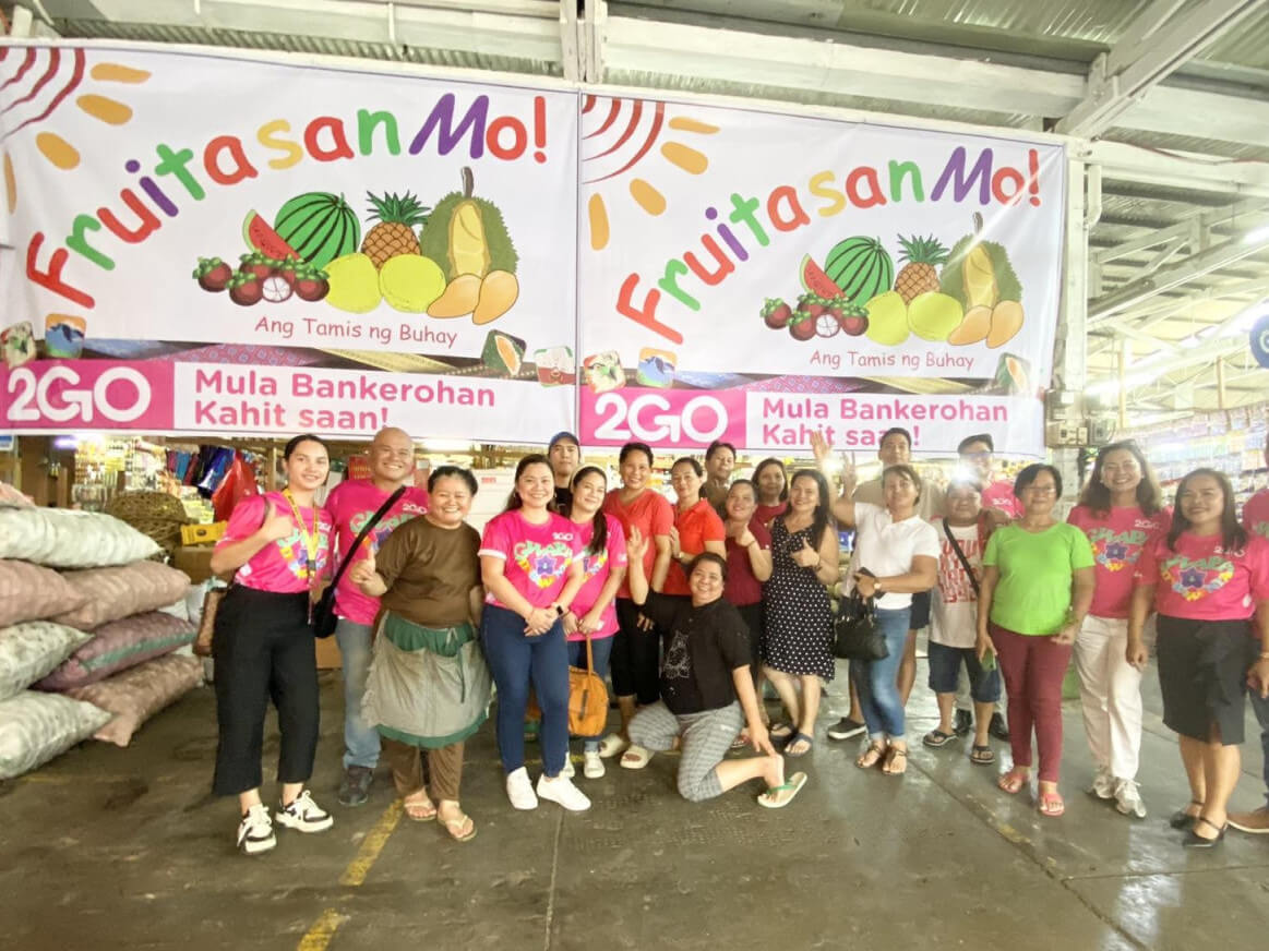 The 2GO Davao team with local vendors at the Bankerohan public market./Contributed photo