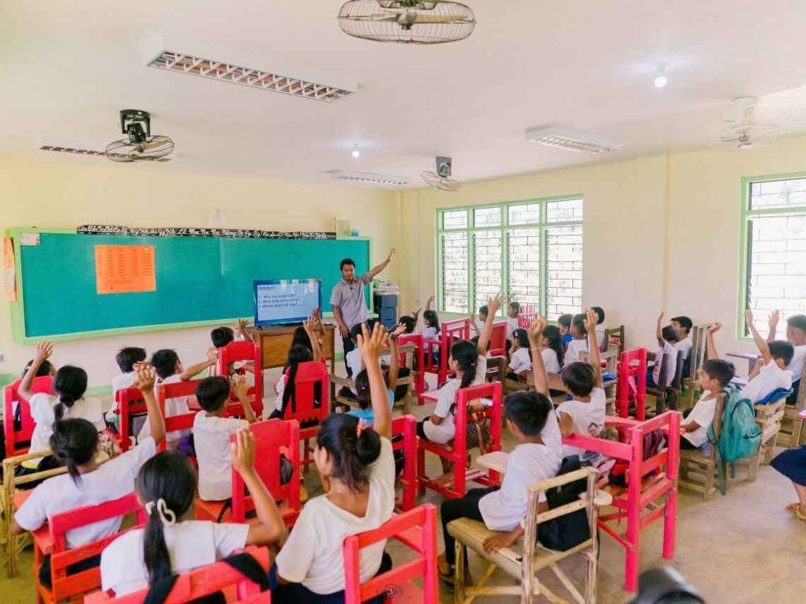 Indigenous students in Calupisan Elementary School embrace interactive learning after OMF energized the school and Meralcoemployees provided multimedia equipment.| Contributed photo