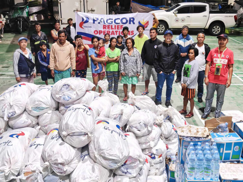 Evacuees sheltering at the TM Kalaw Elementary School and Cipriano Andal MemorialElementary School in Lipa City receive food and non-food packs from Pagcor at theheight of Tropical Storm Kristine’s onslaught./Photo from Pagcor