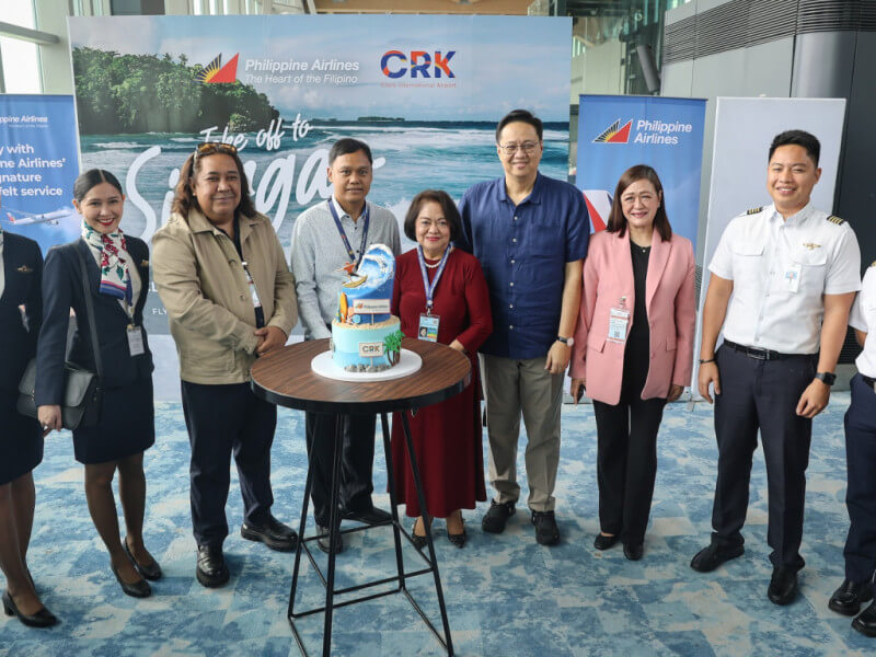 At the cake-cutting ceremony during the Clark – Siargao flight relaunch and send-off were (from left): Department of Tourism Region 3 Director Richard Daenos, PAL Express VP for Ground Operations Matthew Tamaray, Clark Development Corp. President and CEO Atty. Agnes Devanadera, LIPAD President Noel Manankil, and Bases Conversion and Development Authority Vice President for Public Affairs Leilani Macasaet./Photo from Philippine Airlines 