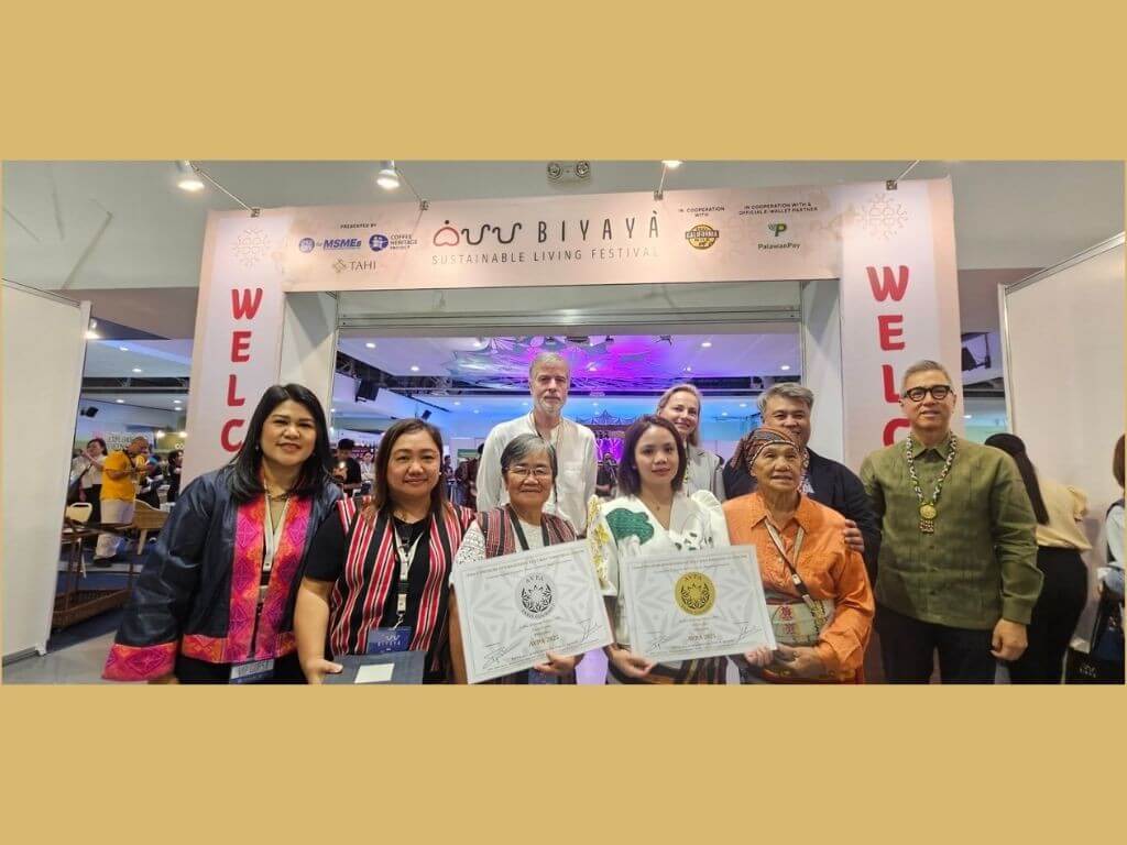 From left: Lilian Castro-Selda, vice chair and CFO of Palawan Group of Companies; Rich Watanabe, founder of Coffee Heritage Project and BIYAYA Festival (2nd from right), together with local coffee farmers who were recognized as awardees of the Agency for the Valorization of Agricultural Products and distinguished guests. | Contributed photo