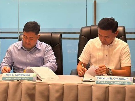 PALECO GM Rez Contrivida inks its PSA with Delta P president Erickson Omamalin to provide 40 MW in additional power to Palawan.| ​Contributed photo
