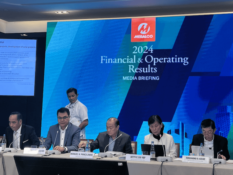 Manuel V. Pangilinan, top Meraclo executives, briefed reporters on their full-year 2024 financial results on Monday (Feb. 24, 2025)./Photo by Miguel R. Camus 