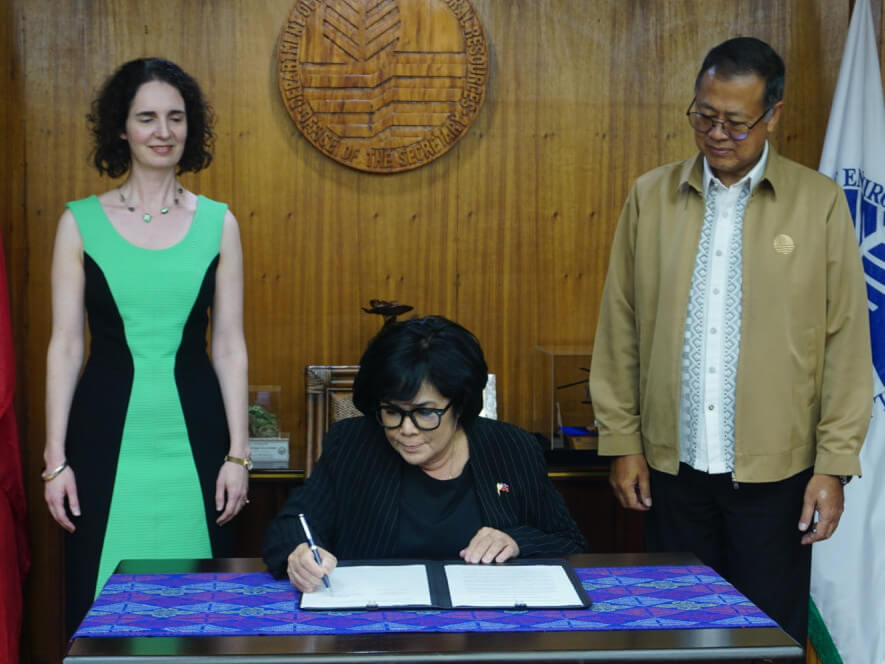 Maria Antonia Yulo Loyzaga signs the pact as New Zealand Ambassador to the Philippines Dr. Catherine McIntosh and Environment  Undersecretary Jonas L. Leones look on./ Contributed photo