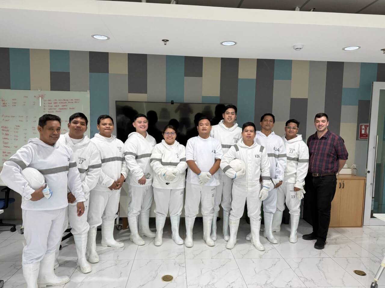 Trainees from the program's pilot batch wear full personal protective equipment (PPE) while learning meat processing techniques under strict food safety, sanitation, and biosecurity protocols. | Contributed photo