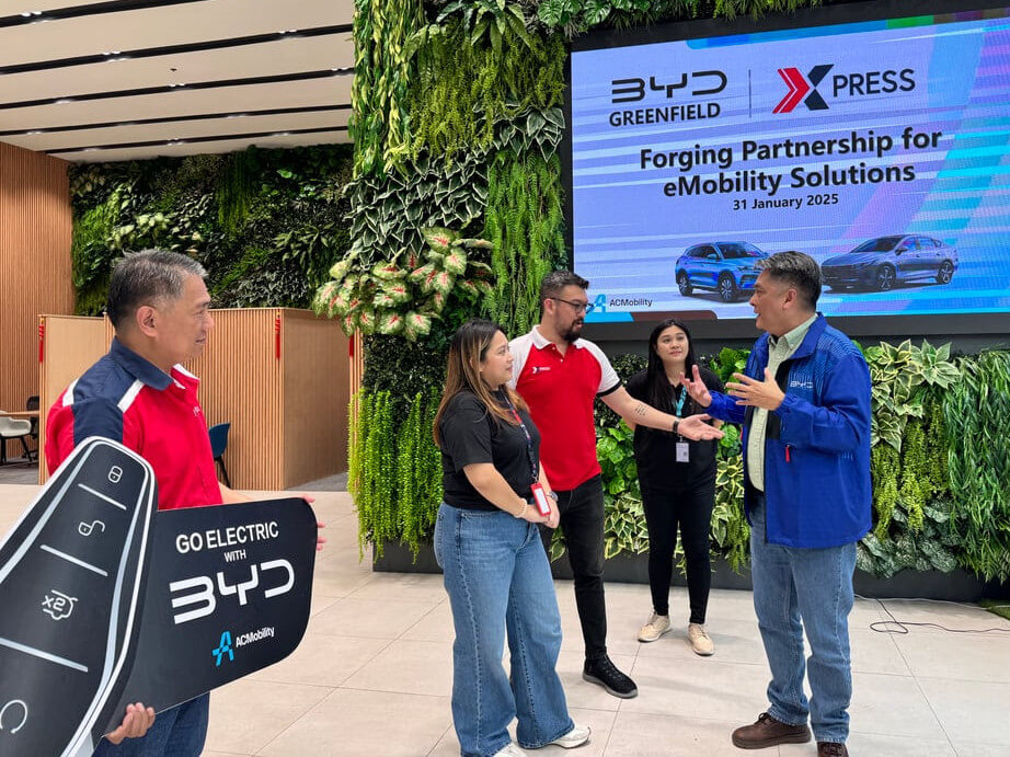 Xpress head of operations Josh Callueng with Alyssa Duldulao, head of Xpress  special projects, strike a momentous deal with BYD/ Contributed photo