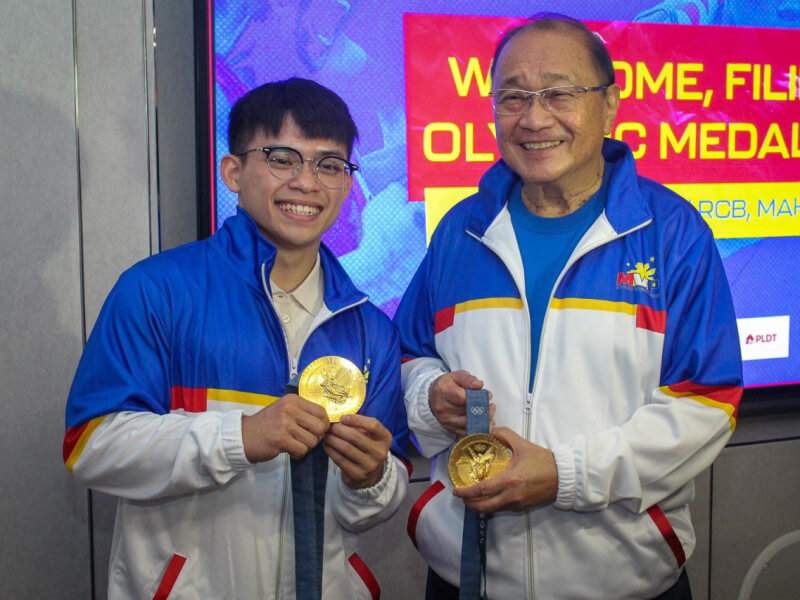 Double Olympic Gold medalist Carlos Yulo meets with PLDT and Smart Chair, CEO and MVPSF Chair Manuel V Pangilinan at the PLDT headquarters in Makati City. (Photo from PLDT/SMART) 