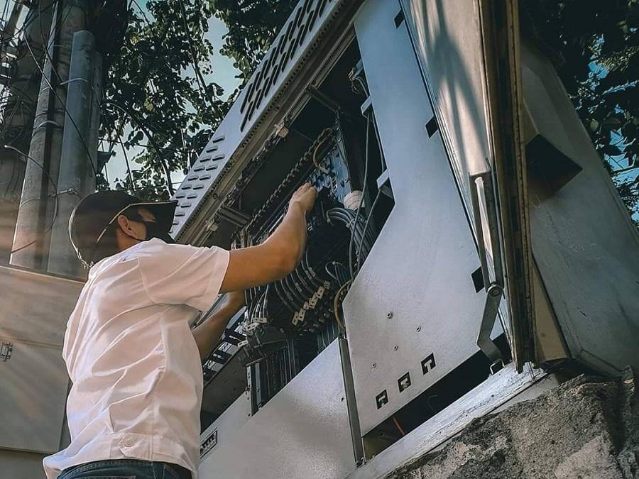 An engineer conducts a routine maintenance check to ensure energy efficiency of network equipment. | Contributed photo