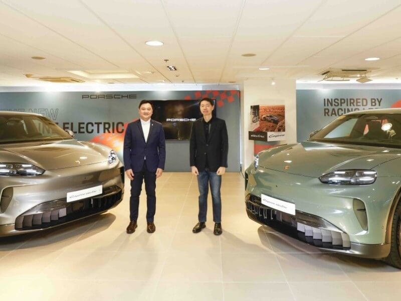 Porsche Philippines President and CEO Roberto Coyiuto III (right) and Managing Director Stephen Recinto present the all-new Cayenne electric in vanadium grey and mystic green exterior colors./Photo ​from Porsche Philippines&nbsp;