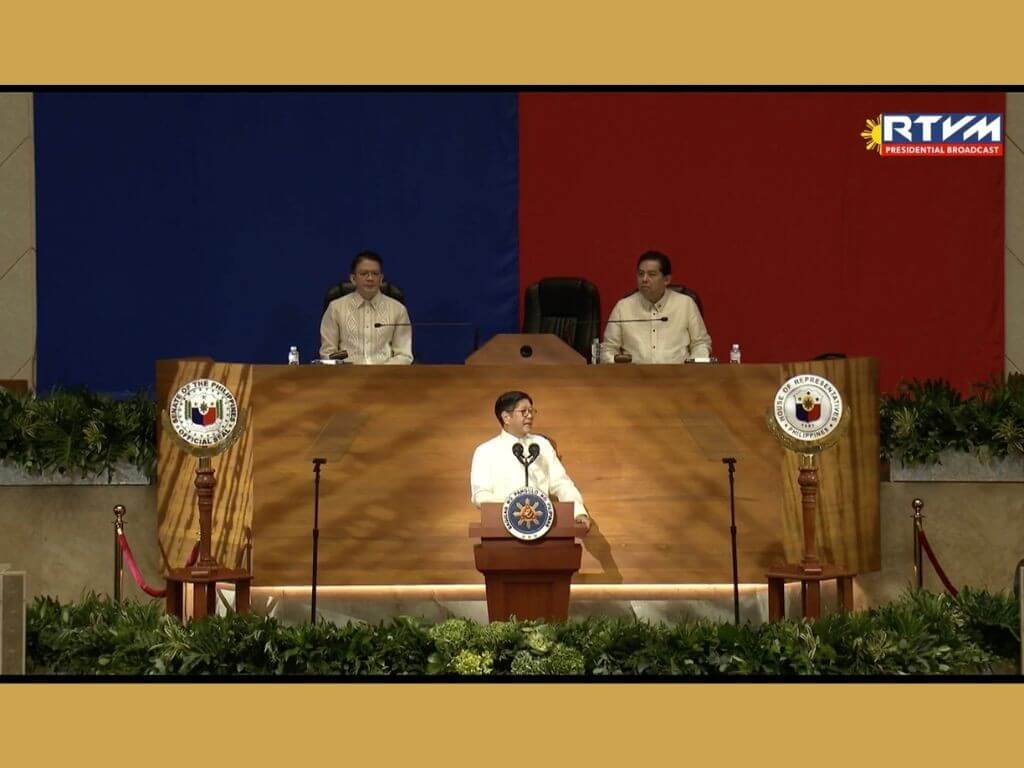 President Marcos delivers his 2025 State of the Nation Address as Senate President Francis Escudero and House Speaker Martin Romualdez look on./Screencap from RTVMalacañang's Facebook feed.