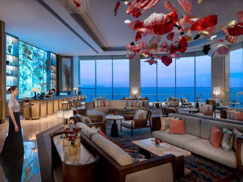 NUSTAR Hotel Cebu's lobby lounge features floor-to-ceiling glass windows that frame breathtaking waterfront views. |Contributed photo