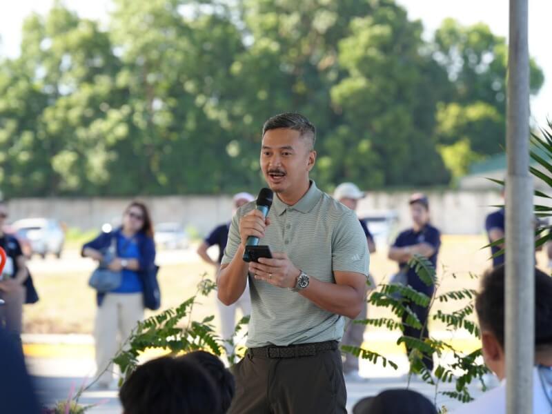 RLC Residences head of marketing Dan Carlo Torres discusses environmental stewardship during the Forbes Estates Lipa tree-planting activity.| ​Contributed photo