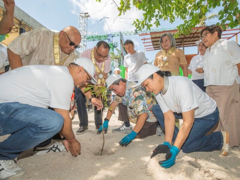 Executives and local officials plant a Molave tree during the Grand Summit Bohol groundbreaking ceremony in Panglao Island, symbolizing strength, resilience, stability, and enduring growth for the upcoming development. | Contributed photo