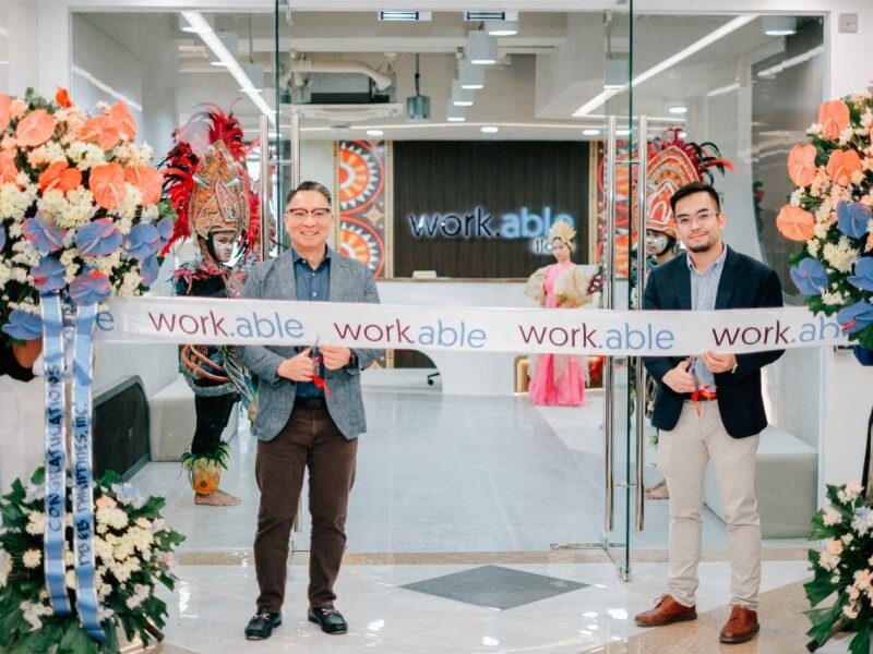 Jericho P. Go, SVP and business unit general manager of Robinsons Offices and work.able landlord, together with Elton John N. Peralta, senior director and head of work.able, led the opening of work.able Iloilo with a ceremonial ribbon cutting. | Contributed photo