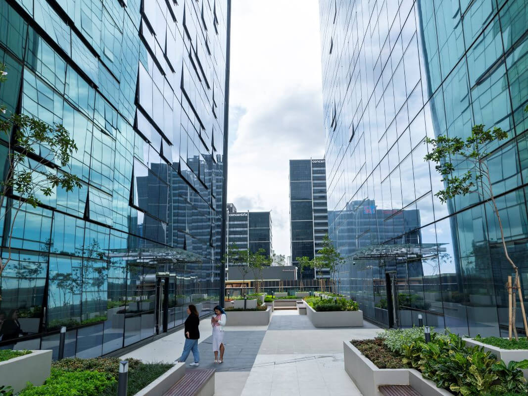 Nestled atop the podium, a serene green oasis offers a tranquil retreat for relaxation and reflection amid the bustling towers./Contributed photo