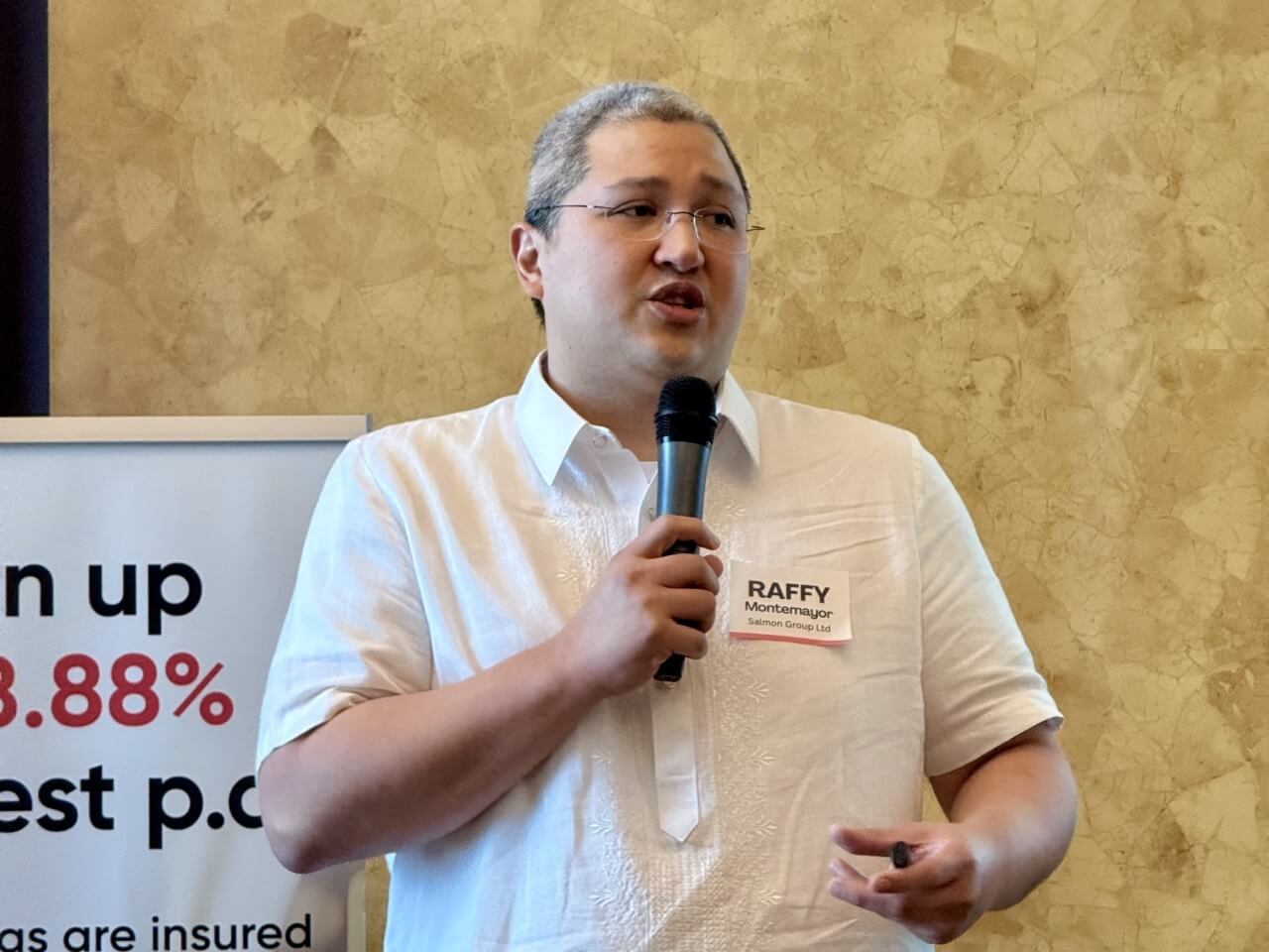 Salmon Group co-founder and bank chair Raffy Montemayor explains the digitally-focused rural bank's first half performance in a media briefing./Photo by Daxim L. Lucas