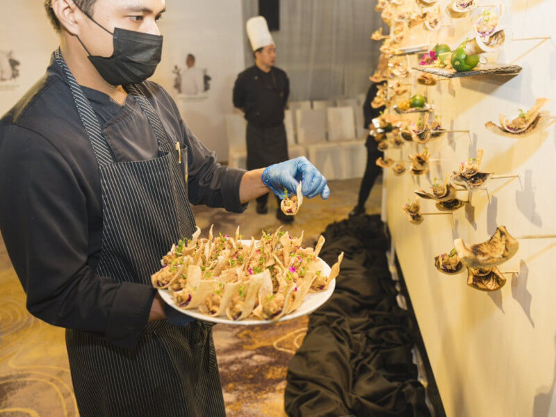 Rebolledo and his team brought Cebuano cuisine to life with modern techniques at the “Old Meets NU Cebu” tasting zone. Highlights included signature creations like Beef & Reef Bulalo, Danggit Biscuit, and Dinuguan Tortas, seamlessly blending tradition and innovation. A standout was the Lechon Five Ways presentation, featuring unique renditions such as lechon quesadilla and lechon with hoisin and leeks, a Fili Café favorite./Photo from NUSTAR 