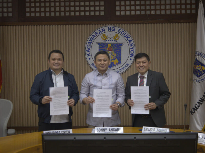 SEC Commissioner Karlo S. Bello, Education Secretary Juan Edgardo M. Angara, and SEC Chair Emilio B. Aquino sign a memorandum of agreement to promote financial literacy at the Department of Education Central Office in Pasig City on Oct. 9./Photo from SEC 