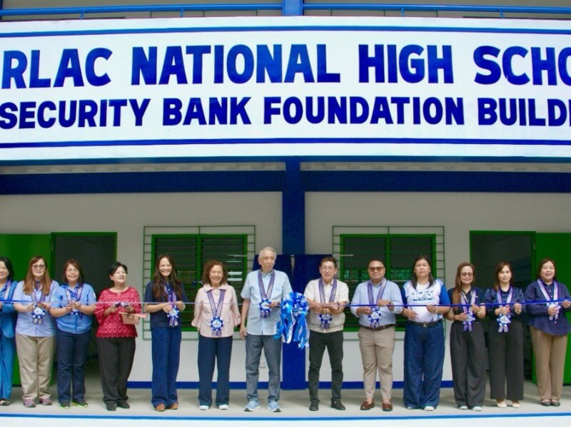Security Bank Foundation chair Rafael Simpao Jr. and Jesus V. Del Rosario Foundation executive director Kana Manglapus led the turnover ceremony for the new two-story classroom building at Tarlac National High School. | Contributed photo
