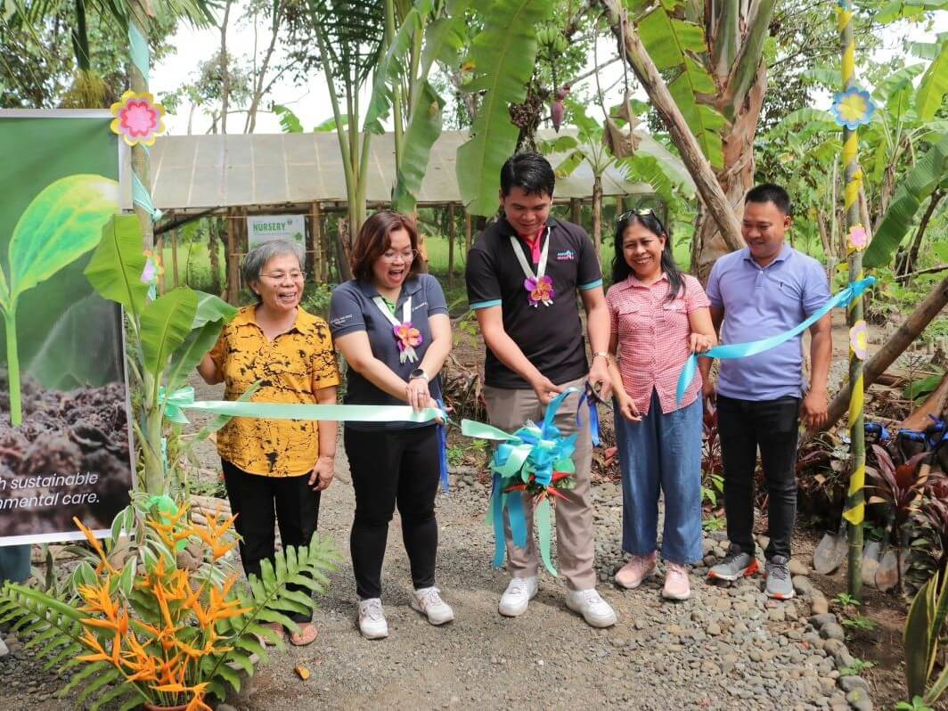 Ribbon-cutting ceremony marking the official launch of the cacao planting, poultry raising, and wilderness rescue programs led by Security Bank, Angat Buhay Foundation, and BUSOE Inc. From left: Lea Dulla, founder and advisor, BUSOE Inc.; Frances Grace Sumulong, corporate social responsibility manager, Security Bank; Menard Mabutol, community engagement and empowerment manager, Angat Pinas Inc.; Glorely Alano, president, BUSOE Inc.; and Ristituto Nobleza, former Brgy. Captain, Kinalangay Viejo./ Contributed photo