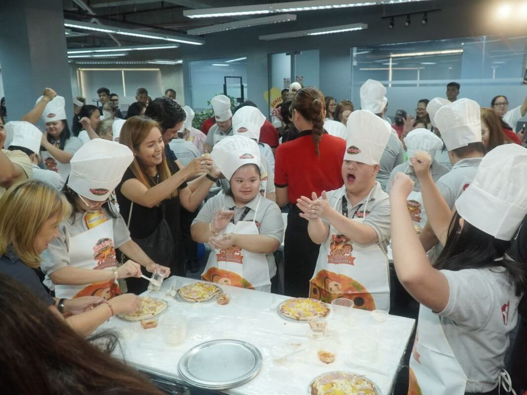 Pizza and Smiles event, a hands-on pizza-making activity designed to build confidence and social interaction among children with Down Syndrome./ Contributed photo