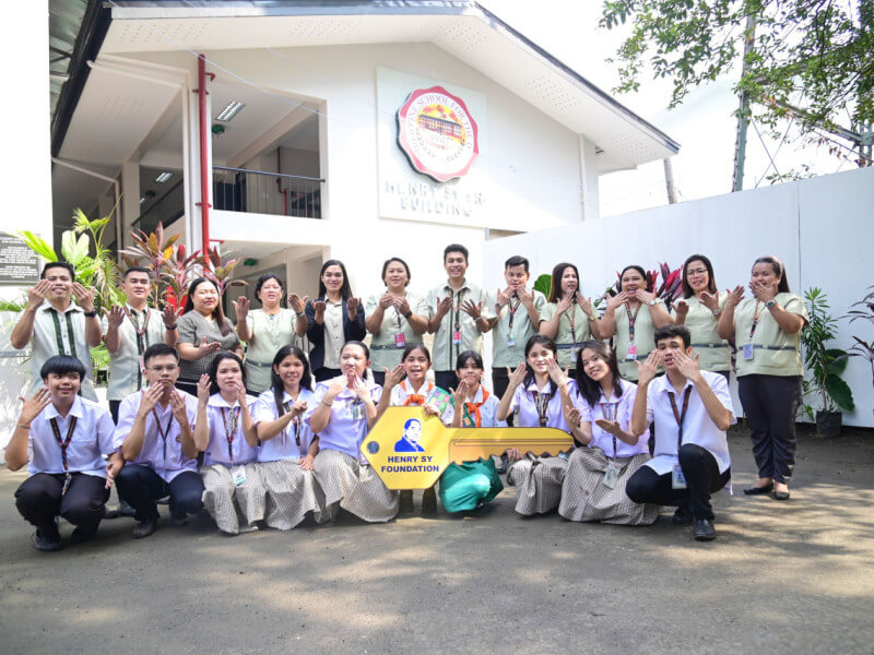 &nbsp;A group of students and faculty hand sign a thankful message following the rehabilitation of their facilities at the Philippine School for the Deaf (PSD)./Photo from SM ​Foundation&nbsp;