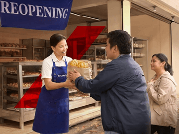 Lucing, a bakery owner whose shop was damaged by a powerful typhoon, and her staff continue distributing bread to residents in need while working toward reopening their business.| Contributed photo