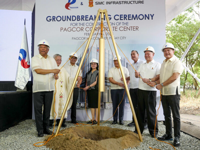 Pagcor chair and CEO Alejandro H. Tengco (extreme left) and SMC chair Ramon Ang (2nd from right) lead the ceremonial laying of the time capsule during the groundbreaking for the Pagcor Corporate Center which will be built by SMC. With them are the members of the Pagcor Board, SMC officials and Fr. Tito Caluag, who blessed the site./Photo from Pagcor